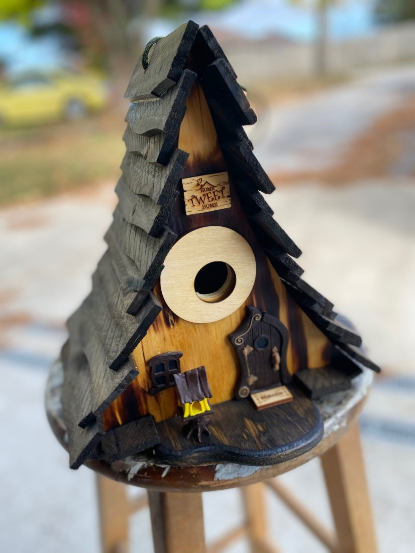 Burned A-frame birdhouse, angled view