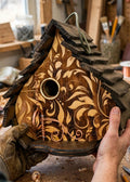 Natural Engraved Dome birdhouse in a workshop setting